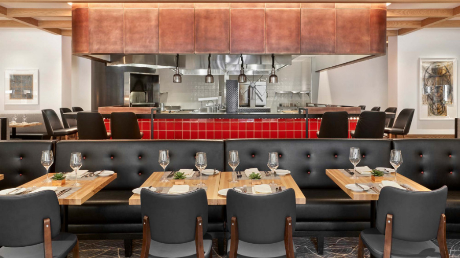 Gensler: Restaurant Interior Design Inspiration. A restaurant room with view to part of the kitchen.